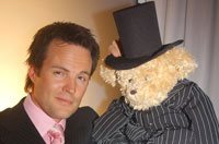 TV presenter, Michael Mol, with his Top Billing bear from the 2005 Rainbow Nation Bear Banquet