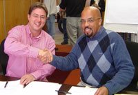 Left to right: Bruce van Halderen, CEO of Loudfire and Kenny Setzin, CEO of Direng Entertainment, shake hands on the deal.