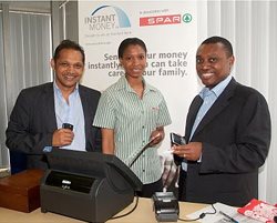 Witnessing the first Instant Money transfer at Beyond Payments' offices in Johannesburg are from left: Herman Singh and Thato Neo Chepape from Beyond Payments, and Sim Tshabalala, Chief Executive of Standard Bank South Africa.
