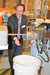 Prof. LJ Grobler stands by while dog food is manufactured during the opening function of an extrusion laboratory at the NWU.<p>Photographer: MacLez Studio
