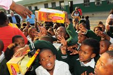 Excited learners get school shoes at Nobhotwe Lower Primary School in Mdantsane.