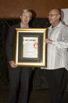 Tony Koenderman receives his Lifetime Achiever Award certificate from AdVantage publisher John Woodford. Pic by Hush Naidoo.