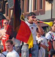 A fan celebrates in Altenstadt, Germany, after his team's 4-0 victory over Argentina in a 2010 FIFA World Cup Round of 16 match on 3 July. (Image: , Flickr)