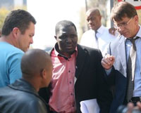 Mzilikazi wa Afrika being arrested at Avusa offices by the Hawks. Photograph by: Sunday Times
