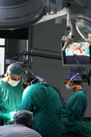 Surgeons performing endoscopic surgery at the Red Cross War Memorial Children's Hospital.