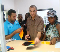 CCDI Product Advisor David van Staden (centre) shows Isaque Mohamed (left) and Dionisia Mambo from Mozambique some different types of heat-transferable vinyl in the CCDI Product Support Space.