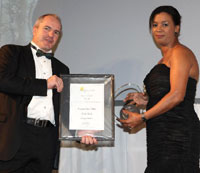 Shamiela Letsoalo, Anglo American marketing and sponsorship manager, hands over a Silver Apex in the Sustain category to James Barty from KingJames for the Allan Gray “Proven over Time” campaign.