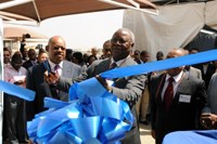 Dr Kiala Ngone Gabriel (Angola secretary Of state and industry) cutting the Nampak blue ribbon to officially open the plant.