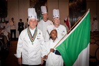 Chefs from South Tryrol with one of the kids from the African Children's Feeding Scheme.