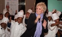 PJ Powers performing &quot;Sing Children Sing&quot; with kids from the African Children's Feeding Scheme at the World Chefs Tour Against Hunger press conference.