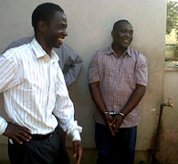 On the right: Ernest Mahwayo in cuffs