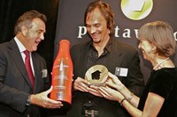 Jean Jacques and Brigitte Evrard award the special Pentaward for the legendary bottle of Coca-Cola.