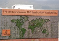 Green billboard welcomes the world