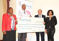 Kraft Foods’ general manager for Central East Africa, Tim Fry, hands over a cheque of US$100 000 (Ksh.10 million) to Abbas Gullet, secretary general Kenya Red Cross. Looking on are Marion Mwangi, country director Cadbury Kenya (left) and Pat Senne Kraft Foods’ corporate affairs and communications director Sub Saharan Africa (right).