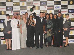 Peter Baumgartner, Etihad Airways’ chief commercial officer, hoists the award for World’s Leading Airline, at the 2011 World Travel Awards gala event held in Doha, Qatar. The airline also received recognition for World’s Leading First Class and World’s Leading Airline to the Middle East.
