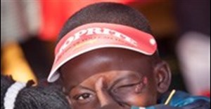 A pupil at Mvelaphanda Primary School in Tembisa, enjoying his soup at the ten million milestone event.