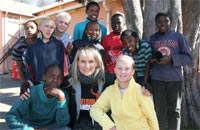 Jacaranda FM's Dianne Broodryk with kids who benefitted from last year's 'Bikers for Mandela Day'.