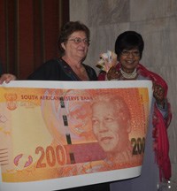 Gill Marcus and Winnie Madikizela-Mandela at the launch of the new Nelson Mandela bank notes.