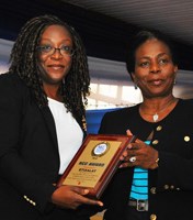 L-R: Biola Edun receives the NCC Award for Excellent Service and effective Collaboration with the Consumer Affairs Bureau to ensure access to Customer Care Help line from Biodun Olujimi.