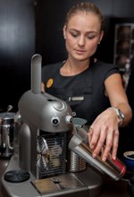 Nespresso barista Irene Jones (V&A Waterfront) using the Gran Maestria to prep a Nespresso Apricot Iced Coffee.