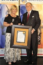 Avril Wilkinson, WESSA national manager for the E&S Programme, receives the 2013 SANEA Energy Education Award from Brian Statham, chairman of SANEA at a gala event held in Johannesburg.