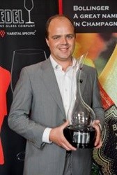 Kayetan Meissner, winner of The Bollinger Exceptional Wine Service Award 2013, proudly shows off the Riedel Glass Trophy.