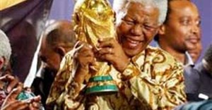 Nelson Mandela holds the World Cup when South Africa hosted the tournament in 2010. Image: