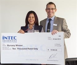 R10,000 bursary winner, Celeste' Bloem is seen receiving her cheque from the general manager for INTEC College, Martin Koch.
