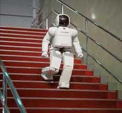 The ASIMO robot built by Honda, walks downstairs to a glittering event in Manhattan. Image: