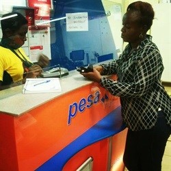 A customer at a PesaPoint Agent Network outlet.