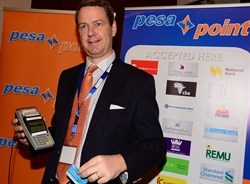 Frederik Eijkman, CEO PesaPoint Agent Network demonstrate the services on PesaPoint Agent network.