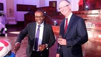 A slice of (healthy) life: Teddy Mosomothane (Bankmed CEO) and Charles Wells (Bankmed Chairman) at the Bankmed Chairman's Centenary Celebration
