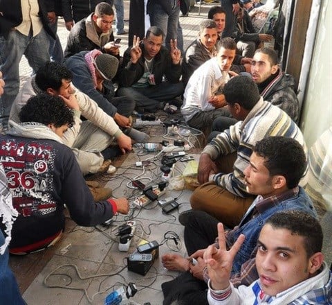Protesters in Tahrir Square charge their cellphones at the height of the Arab Spring uprising. (Image credit: Ken Banks. Ken Banks. Source: )