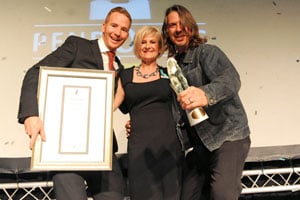 Cameron Watson (left) and Michael Wilson of King James Cape Town receive the coveted Umpetha Award for the best Truly South African work for their advertisement “The Reader” for Bell’s Whisky. The award was handed over by Franette Klerck, the General Manager of the Pendoring Advertising Awards.