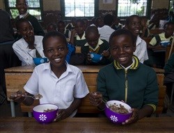Lungisani Zondi (11) and Siyanda Shozi (12) enjoy breakfast at Jubilee Senior Primary School, Mariannhill.