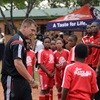 Spur Masidlale and Orlando Pirates distribute kits at soccer clinic
