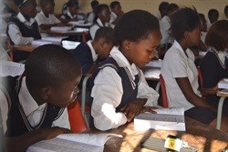 Gugu Motsamai, and fellow Grade 7 learners at Mmuagabo Primary School, learning how to use their new dictionaries