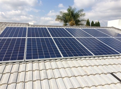 An array of 12 roof-mounted photovoltaic (PV) panels