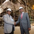Programme manager for TNPA’s R1.4bn tug contract, Eugene Rappetti (left), with Southern African Shipyards CEO, Prasheen Maharaj (right) in front of work on one of nine tugboats being built for the port authority.