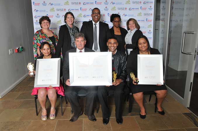 False Bay College Students were acknowledged for their outstanding performances at the Provincial TVET Awards. Back Row: Melanie Vermaak (FBC Academic Head: NC(V) and Nated Programmes), Beverley Shepherd (FBC Fish Hoek Campus Head), Malcolm Meyer (FBC Programme Head), Susan Mhakure (FBC Programme Head), Souchan Jackson (FBC Mitchell’s Plain Campus Head); Front Row: Ashley Fredericks (FBC Student), Cassie Kruger (FBC Principal and CEO), Alcino Van Rooyen (FBC Student), Debra Dudley (FBC Student)