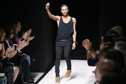 French fashion designer Olivier Rousteing for Balmain acknowledges the public at the end of his 2015 Spring/Summer ready-to-wear collection fashion show, on 25 September 2014 in Paris.<p>Image credit: