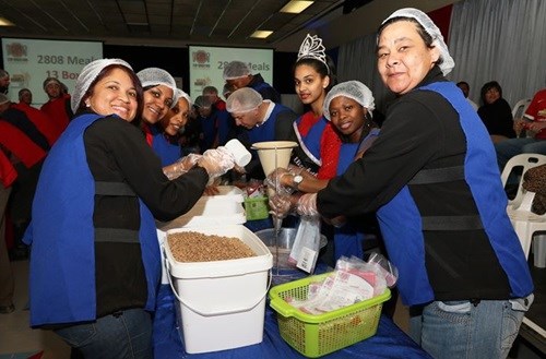 General Motors employees in high spirits during their 67 minutes on Mandela Day