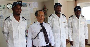 Captain of Cape Orchid Edgardo De ASIs with the three South African cadets placed on the vessel for six months. They are [L-R] Samkelo Ndongeni (25) a deck cadet from Ngqushwa near King Williams Town, Thembani Mazingi (24) an engine cadet from Cofimvaba, and Gordon Sekatang (26), also an engine cadet from Nelspruit.