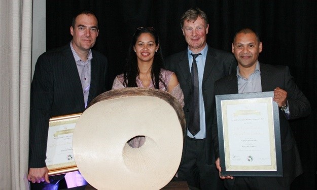L to R: Ruben Brandt, Janine Charters, Loutjie de Jongh and Lance Kallis of Mpact Containers with the SAPRO Trophy for the Recycled Product of the Year Award.