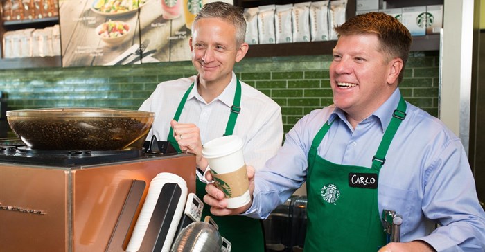 Carlo Gonzaga, CEO Taste Holdings, doing what he enjoys most, being hands on and serving a customer at a Starbucks store in London.