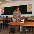 Grade 2 educator, Kwanele Nombekana, assists Busi Ndebela in one of the new classrooms.