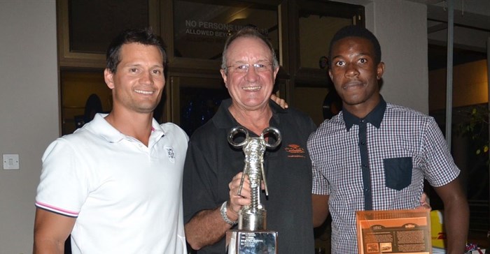Winners Blair Taberer (left) and Munya Mudyanadzo (right) being presented with their trophy by AAT group chairman Dave Glynn(middle)
