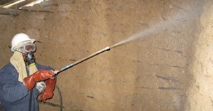 Elissa Jensen/USAID via  - Indoor Residual Spraying (IRS) of insecticides in a dwelling in Mozambique.