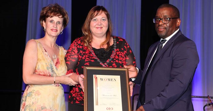 Marna van der Walt, CEO of Excellerate Property Services (centre), receives the award for Most Influential Woman in the Building and Construction sector from Annelize Wepener, Chief Executive of CEO Global (left); and Commander Tsietsi Mokhele, CEO of SAMSA (right).