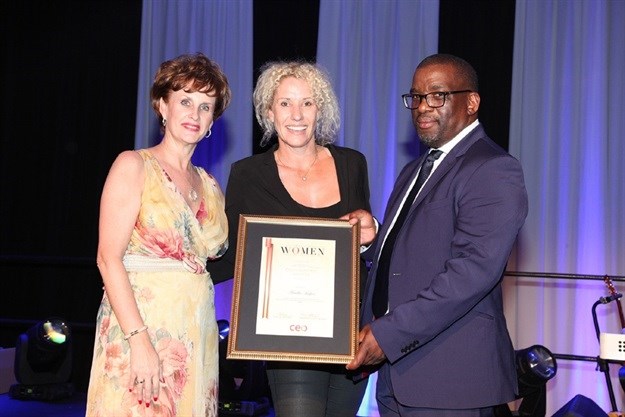Ariella Kuper (middle) receiving her Continental Award in the Mining Sector for CEO Global Africa's Most Influential Women in Business and Government.